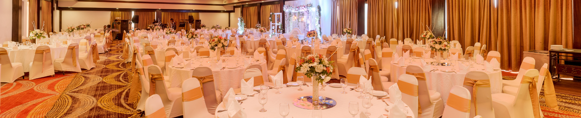 Festive wedding reception hall with centerpieces