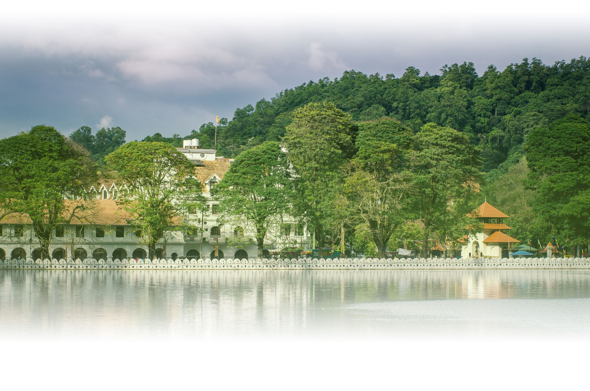 Kandy Lake in Sri Lanka, featuring the white decorative cloud wall