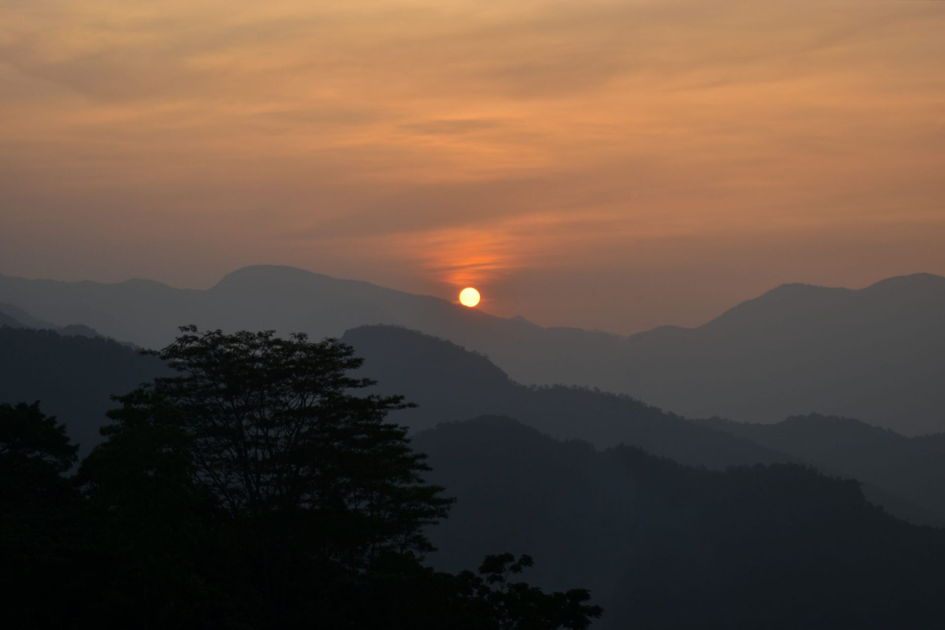 Sun setting among the hills
