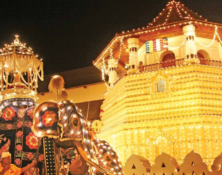 Temple of the Tooth Relic lit up during Esala Perahara
