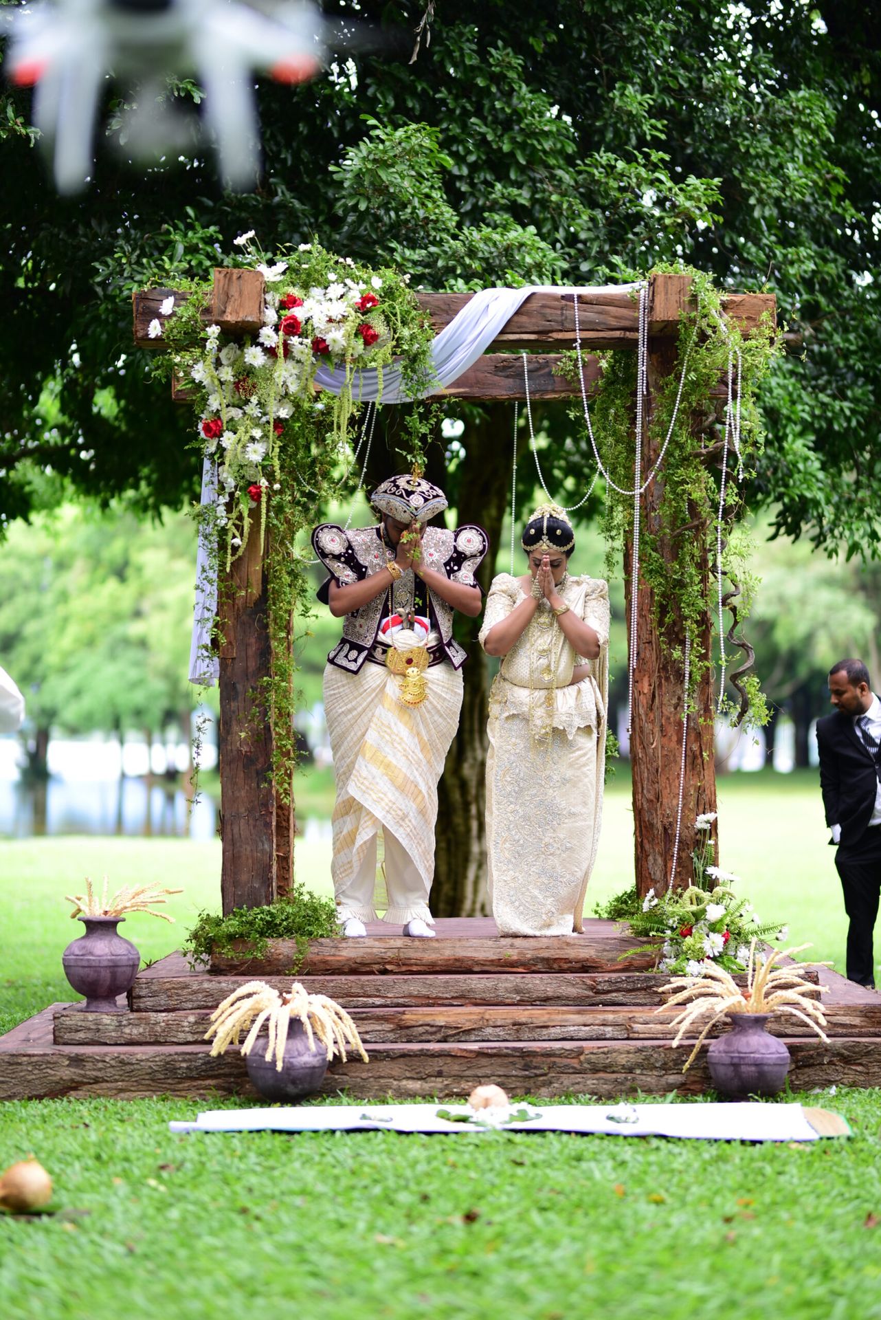 Traditional wedding ceremony on wooden Poruwa