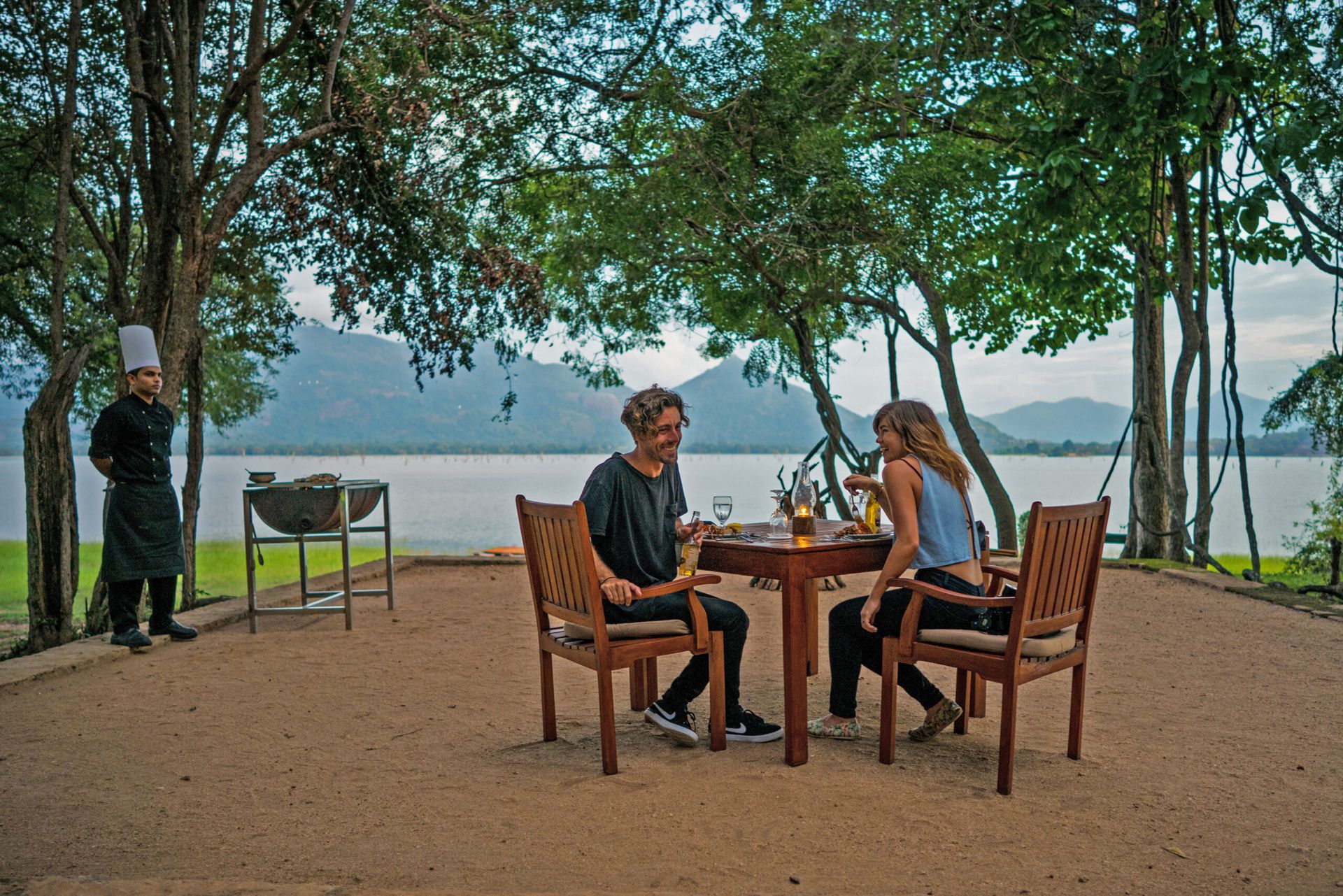 A couple enjoying a drink by the lake at Amaya Lake Dambulla
