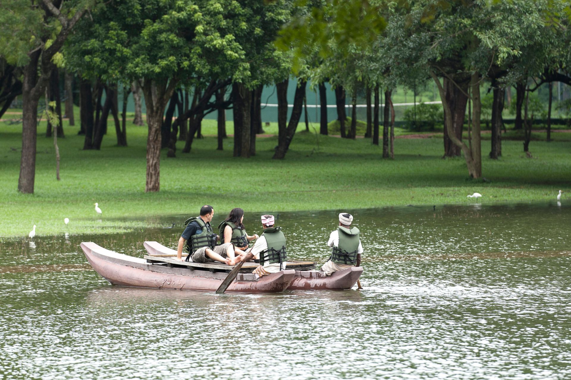Couple going on a traditional boat ride at Amaya Lake Dambulla