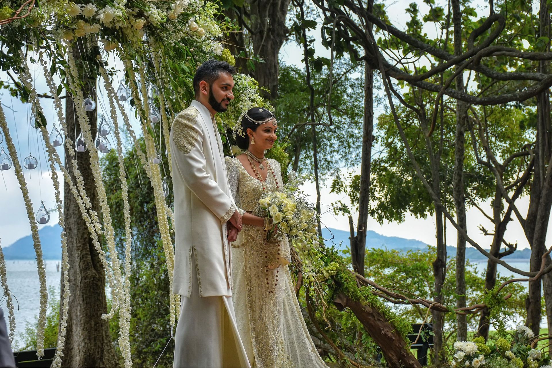 Couple in traditional attire at their wedding