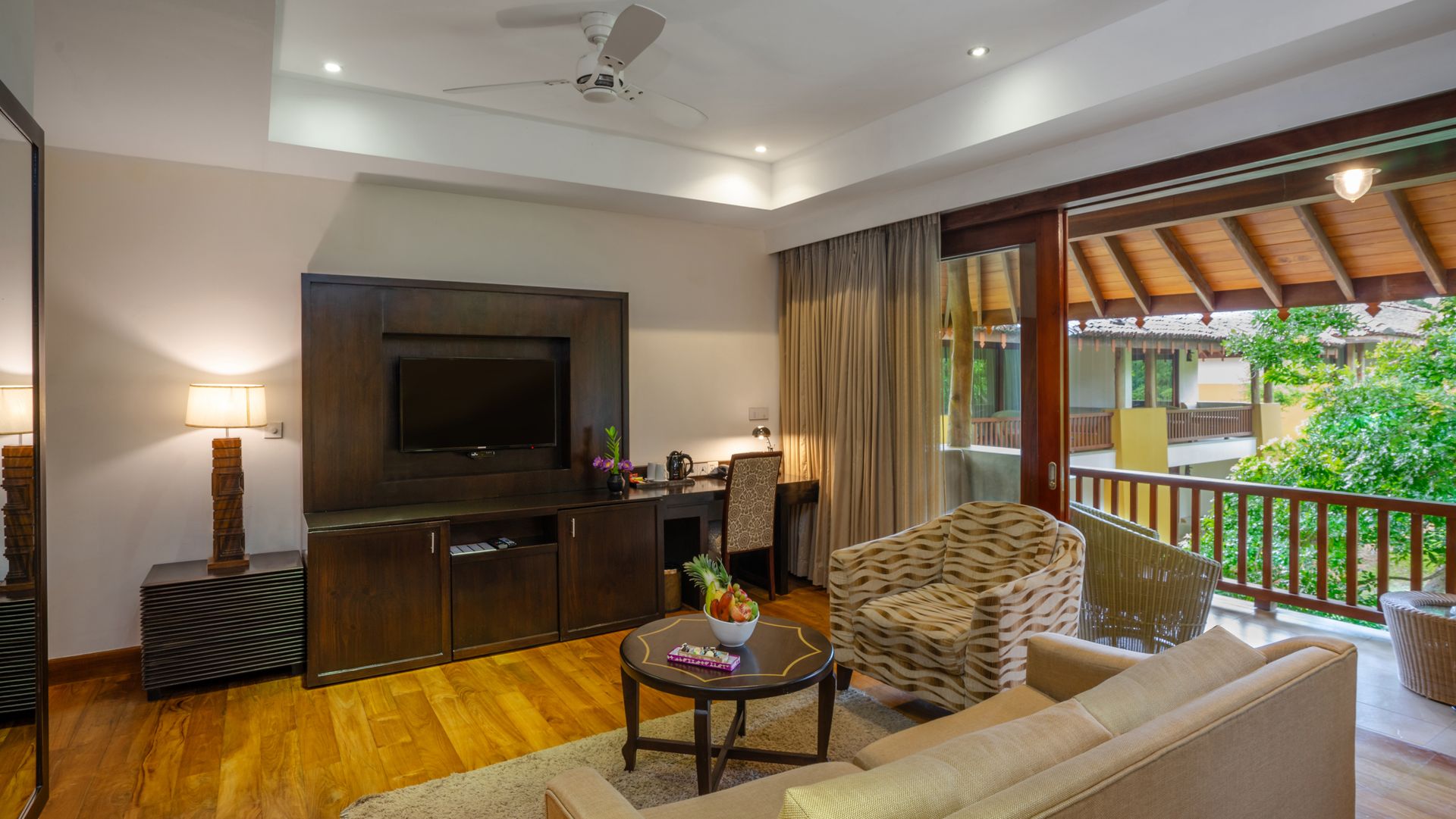 Comfortable living room with television in a signature suite at Amaya Lake Dambulla