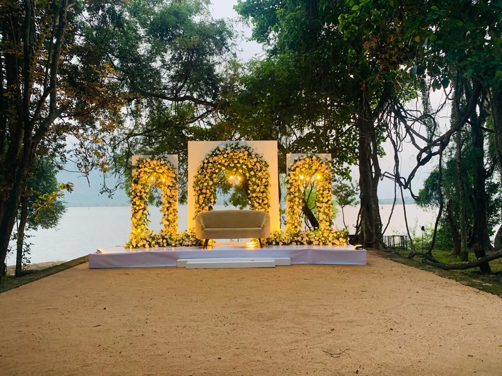 Floral wedding stage at an outdoor wedding at Amaya Lake Dambulla