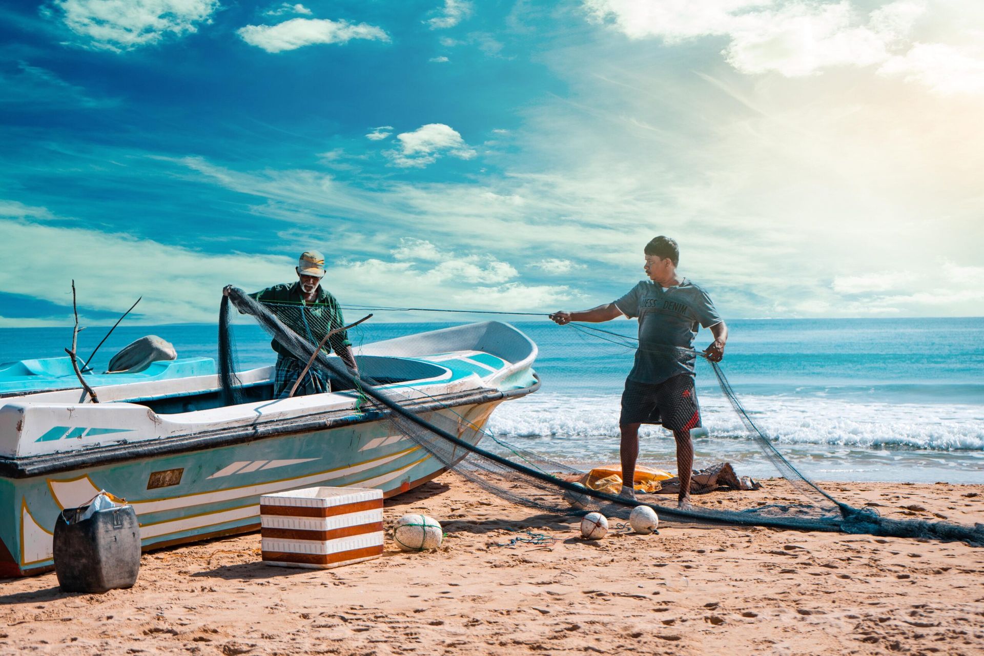 Two fishermen readying their nets