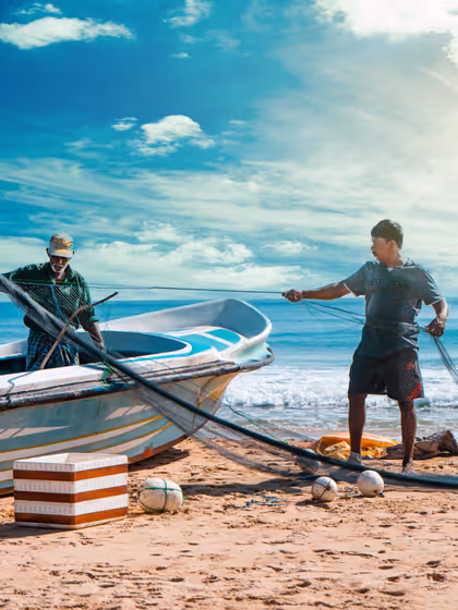 Two fishermen readying their nets