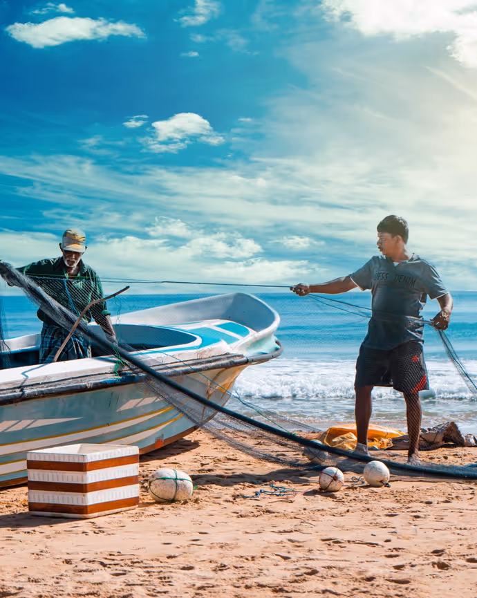 Two fishermen readying their nets