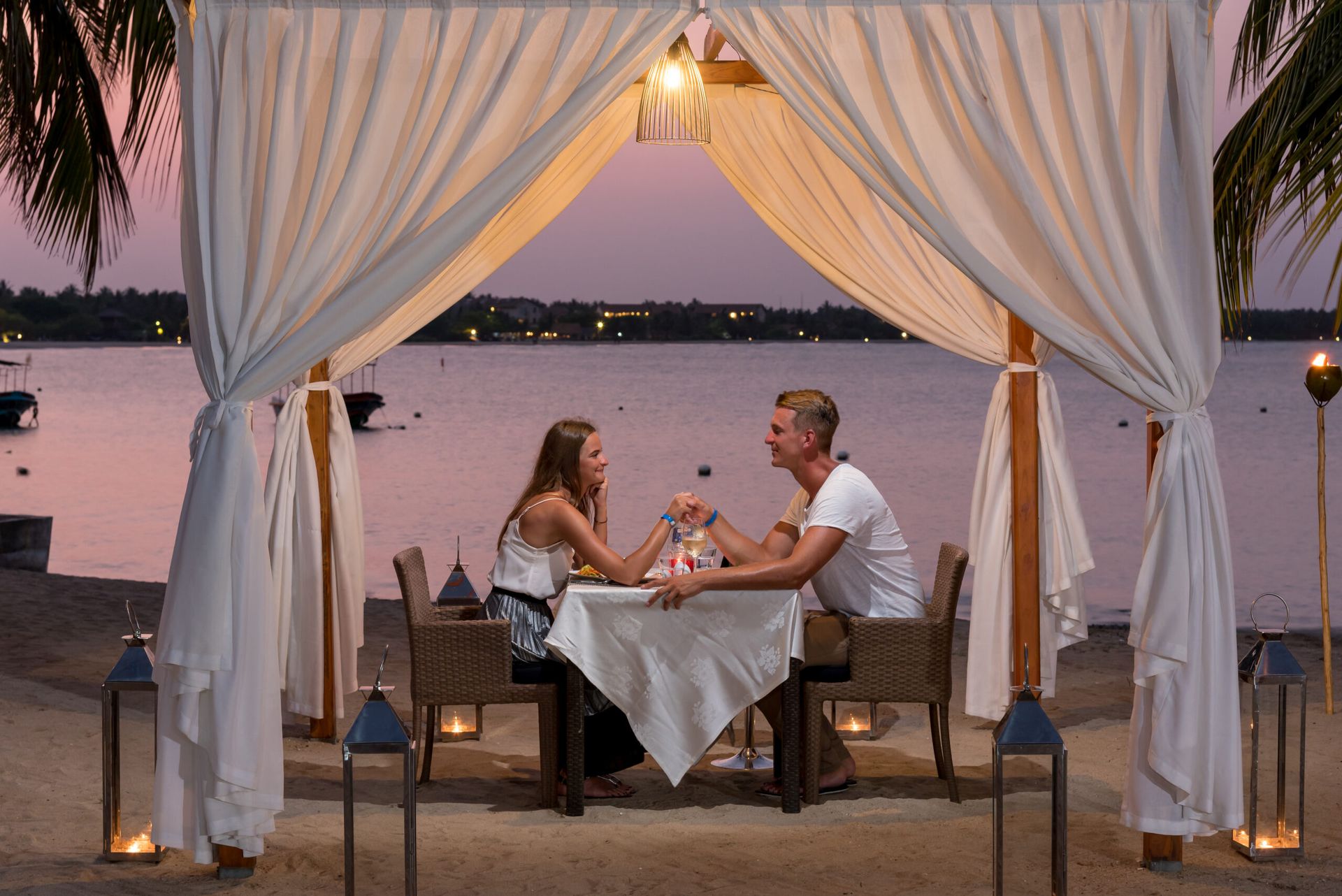 A couple enjoying a candelight dinner at Amaya Beach Pasikudah